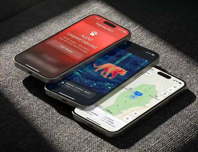 Three overlapping space grey iPhones on charcoal fabric. The screens show a "Leopard Detected" red alert, a thermal video clip, and a GPS map of the sensor location.