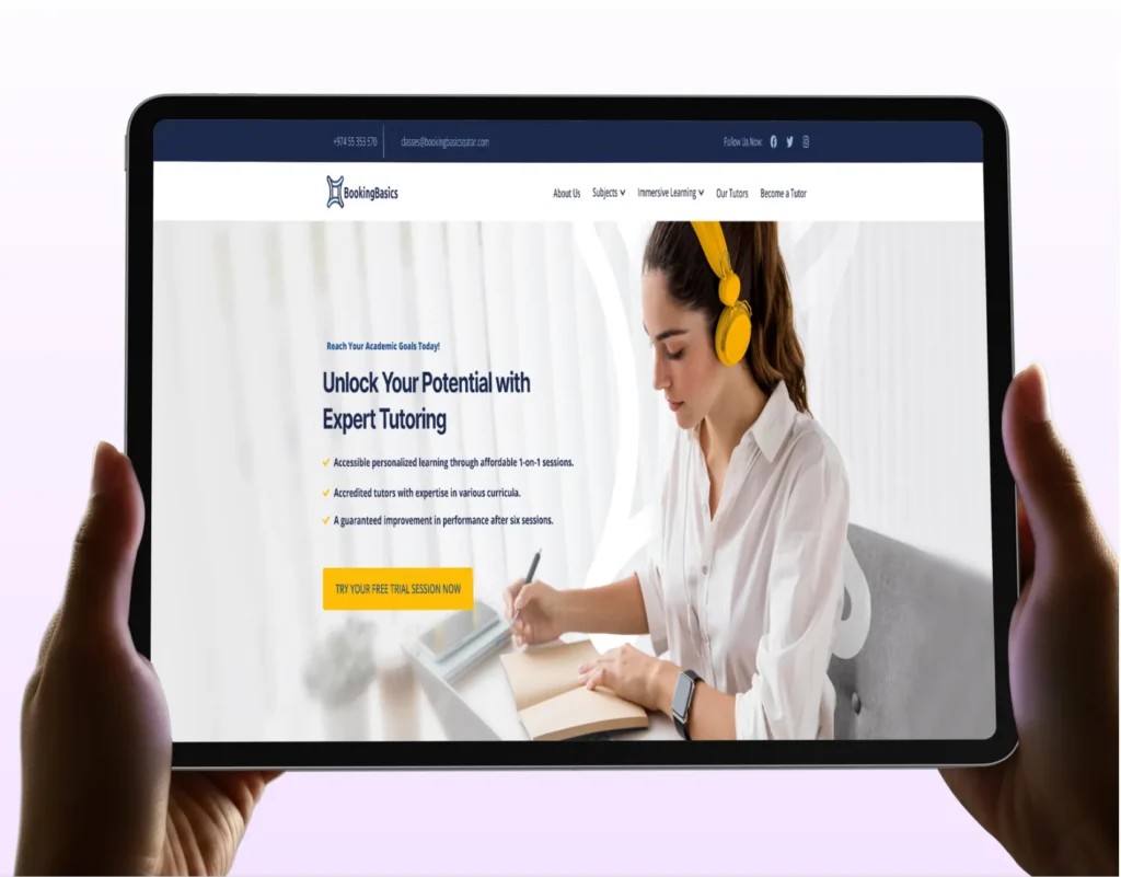 A digital mockup of a person holding a tablet displaying the desktop homepage of the "Booking Basics" tutoring platform. The screen features a white layout with a dark blue top banner, a bright yellow "Try your free trial session now" button, and an image of a student wearing yellow headphones while writing in a notebook.