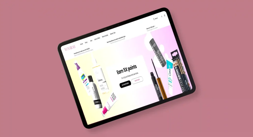 Angled tablet mockup displaying the Wonairah beauty and skincare e-commerce website on a soft pink background, featuring product promotions, cosmetics, skincare items, and a clean modern user interface.